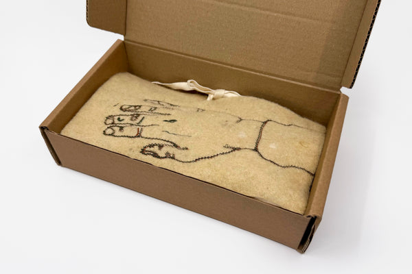 De Omhelzing miniatuur